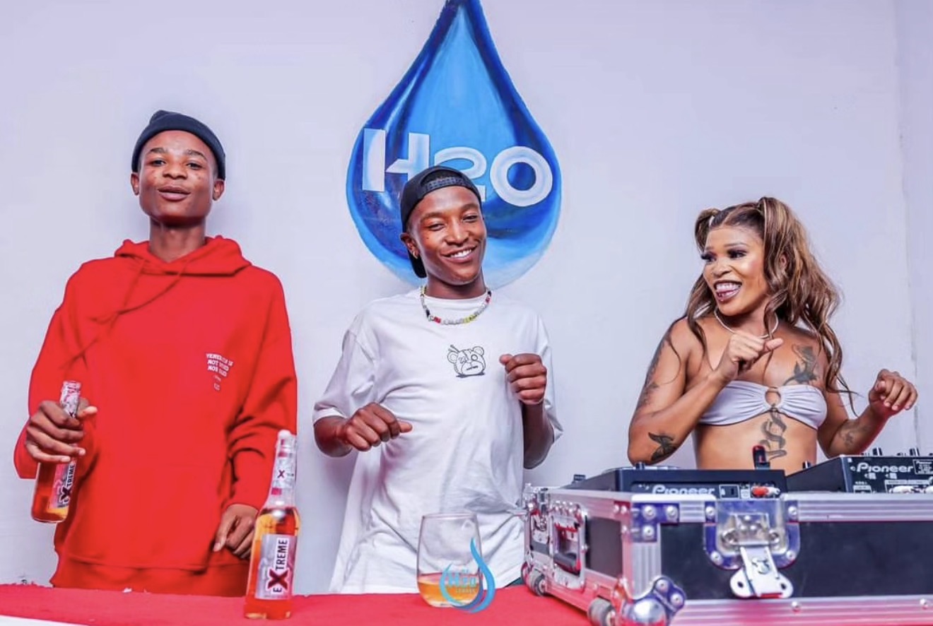 DJ booth at De H₂O Lounge with H2O drop logo