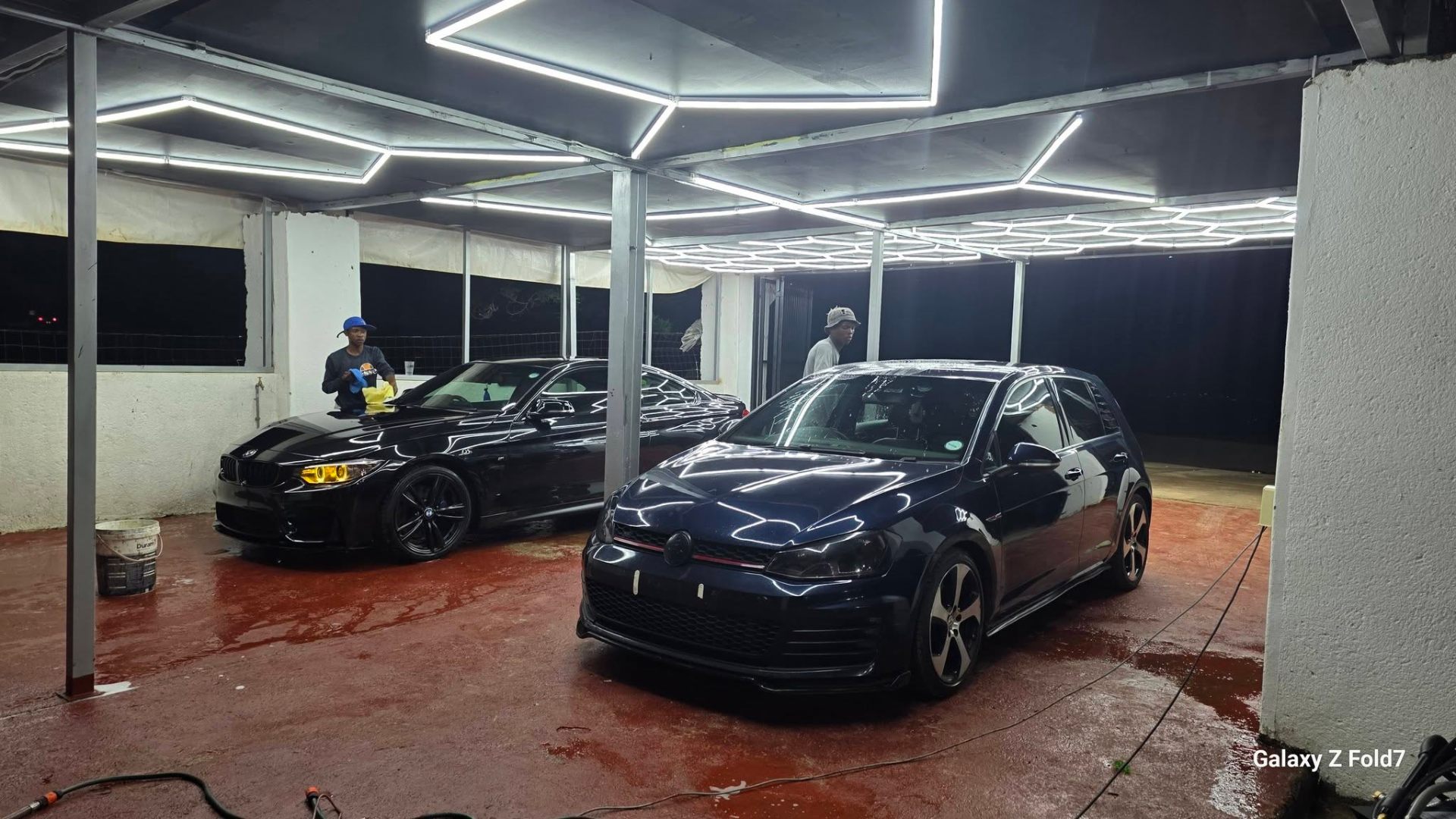 Glossy luxury car after De H₂O detail wash